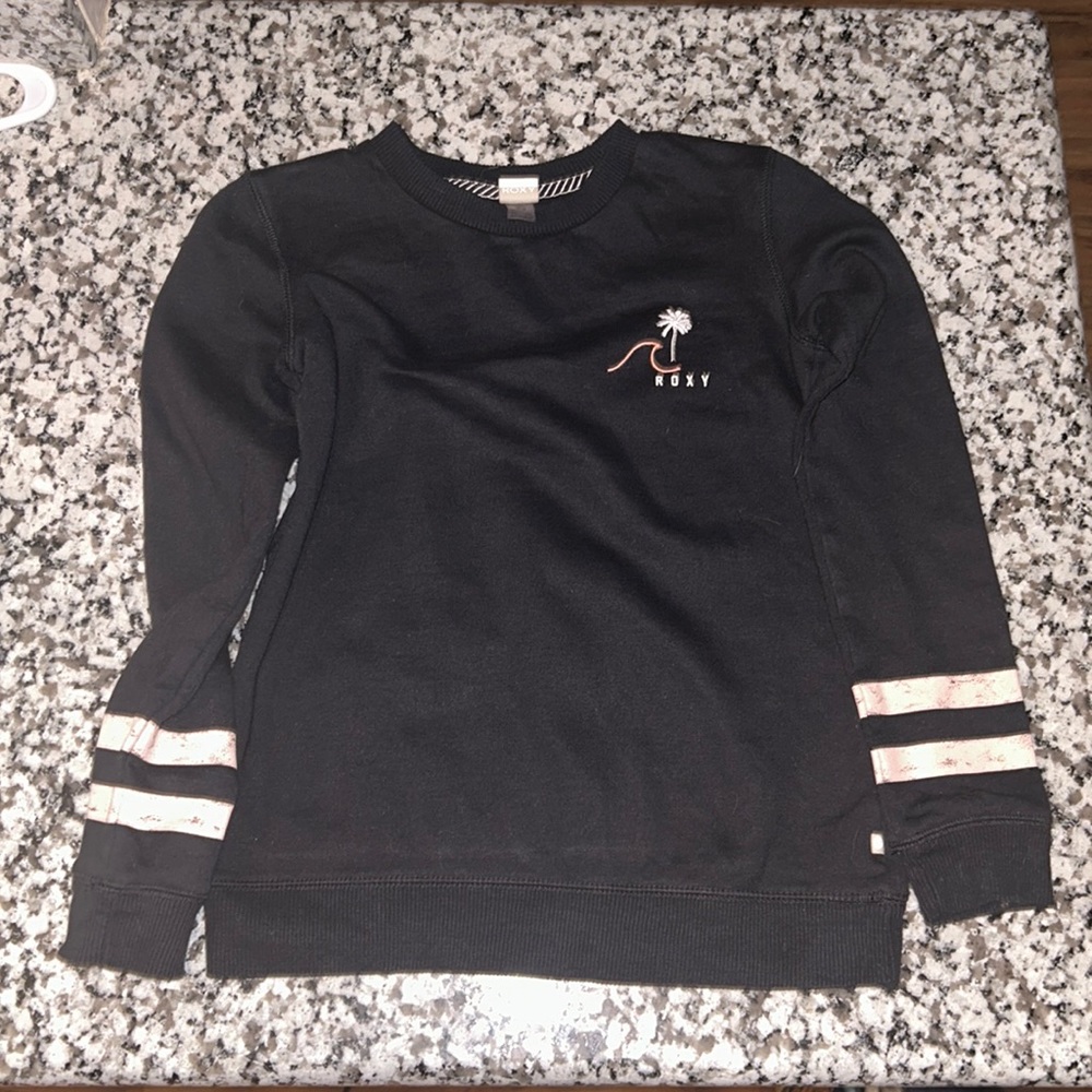 Roxy Girl Black with Roxy Logo on front, pink stripes on arms. Girls size 10.